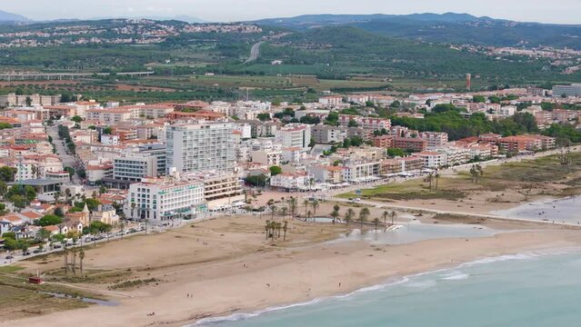 Aerial drone view of the coastal town named Comarruga in the province of Tarragona, Spain