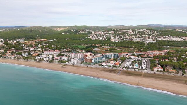Aerial drone view of the coastal town named Comarruga in the province of Tarragona, Spain