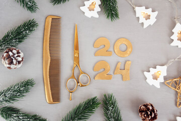 Numbers 2024 golden colored scissors and comb with fir twigs on gray background. Template greeting...