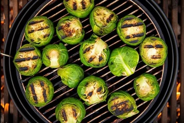 Deurstickers overhead shot of a grill filled with charred brussels sprouts © Alfazet Chronicles