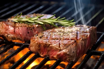Tuinposter steak grilling with a sprinkle of sea salt © Alfazet Chronicles