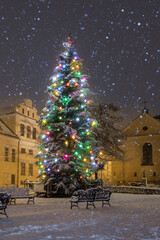 Winter in Krakow, Christmas Tree and St Francis church in the snow, night, Poland