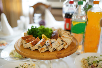Delicious meat cut from baked minced meat laid out on a wooden cutting board.