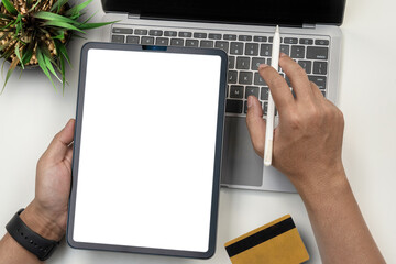 Business people hands working on modern Tablet and laptop. Online Shopping.