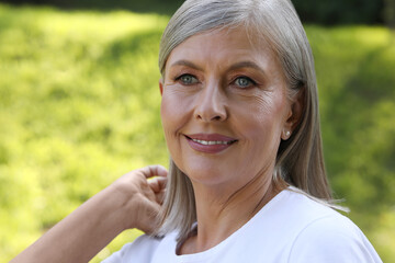 Portrait of beautiful happy senior woman outdoors