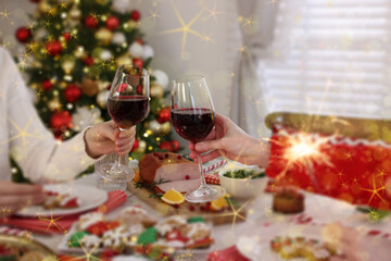 Naklejka na ściany i meble Family clinking glasses at festive dinner indoors, closeup. Christmas celebration