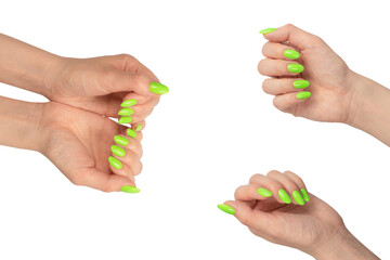 Hand of a woman with green naols hold some tiny or thin object.