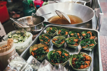Fried fish cake at shopping street food market Bangkok Thailand