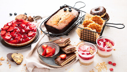 Table with various cookies, donuts and cakes. Holiday concept.