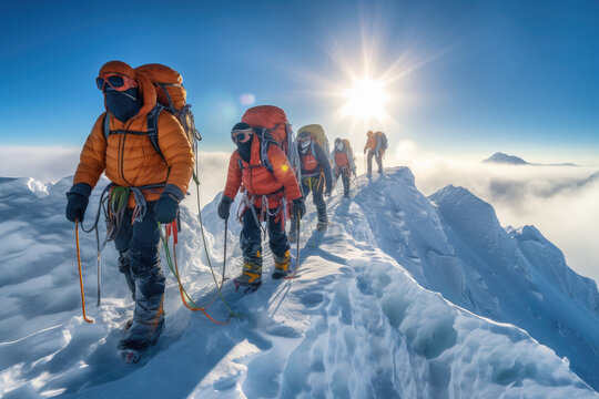 Image of a group of Sherpas and mountaineers climbing Mount Everest on a sunny day. It goes with all their equipment to be able to reach the summit.