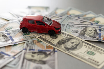 Toy car, key and money over white. Rent, buy or insurance car concept