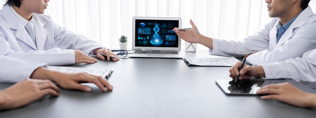 Group of doctor or researcher studying genetic disease in DNA with laptop, analyze genetic data, formulate medical treatment strategies, and develop healthcare plan with innovative solution. Neoteric