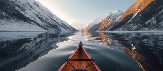 Canoeing on a lake at the edge of the icy mountains