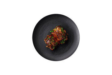 Delicious juicy fried chicken in teriyaki sauce with salt, spices, herbs and sesame seeds