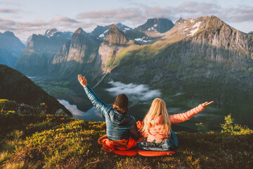 Couple enjoying mountains friends hiking together travel adventure vacations with camping gear, Man...