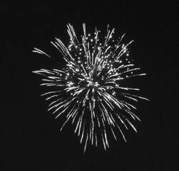 Fireworks in the night sky in black and white
