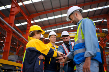 Blue collar worker work at metal sheet factory.