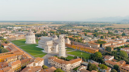 Fototapeta na wymiar Pisa, Italy. Famous Leaning Tower and Pisa Cathedral in Piazza dei Miracoli. Summer. Morning hours, Aerial View