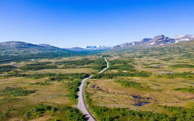 Road leading through breathtaking landscape in Sweden near Handöl