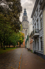 Fototapeta na wymiar An old street in the city center of the capital Groningen, with the so-called 'Martini tower' in the background. And called 'olle grieze' by the locals