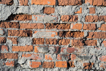 texture of old cracked and destroyed red brick wall