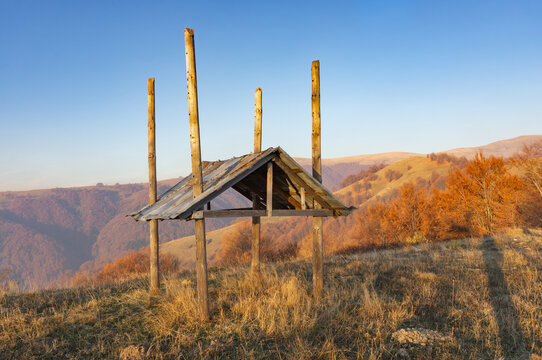 Hay shed against the backdrop of an autumn mountain landscape. Morning in the autumn Carpathians