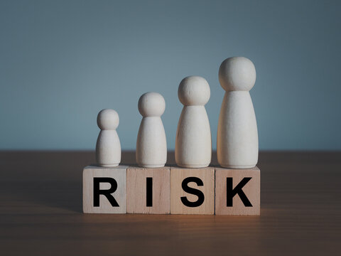 Risk elimination, hedging concept Response planning on wooden blocks