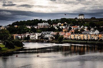 Fototapeta na wymiar Beautiful colorful buildings in Trondheim, Norway. Colorful buildings by the Nidelva River.