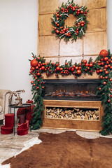 Fototapeta na wymiar Cozy apartment, artificial electric bright fireplace with fake sparkling flame. Christmas Tree gifts presents garlands, decorated toys balls interior New Year 