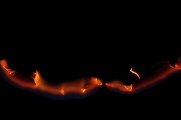 burning paper, glowing edge of paper on a black background