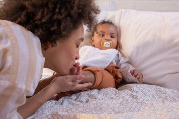 Mother kissing baby