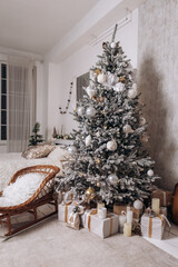 Vertical photo cozy flat apartment photo studio room sled sleigh green Christmas Tree gifts presents garlands, candles decorated toys balls interior New Year lights glowing bokeh 
