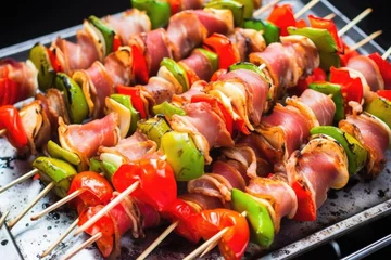 Deurstickers freshly grilled brussels sprouts and bacon skewers on aluminium foil © primopiano