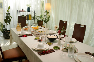 Dinner table with various snacks and dishes served for family dinner