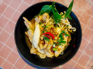 This menu is called Khanom Jeen Ya Pa' with a spicy taste.