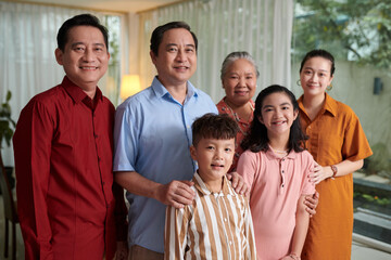 Portrait of big family gathered at home to celebrate family event