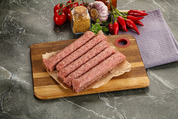 Fototapeta na wymiar Raw beef kebab sausage for grill