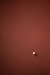 Drop of milk on the brown surface