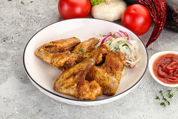 Grilled chicken wings with sauce