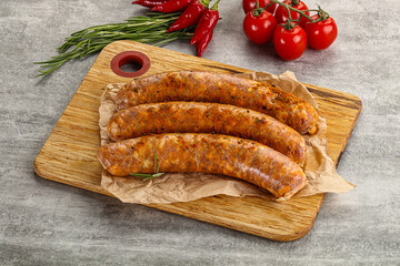 Raw sausages with spices and herbs