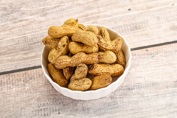 Raw ripe unpeeled peanut heap