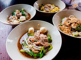 The photos of boat noodles, a flavorful and aromatic Thai dish, evoke a sense of culinary adventure and a journey into the heart of Thai street food culture.