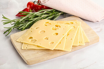 Sliced maasdam cheese with holes
