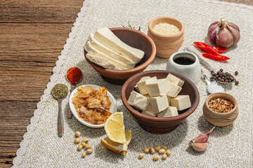 Set of ingredients for preparation Tofu. Fresh diced cheese, spices, herbs and soy sauce