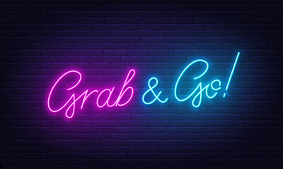 Grab and Go neon sign on brick wall background. - obrazy, fototapety, plakaty
