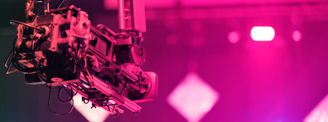 TV camera on a crane at a football match or concert. Close-up live video broadcast camera