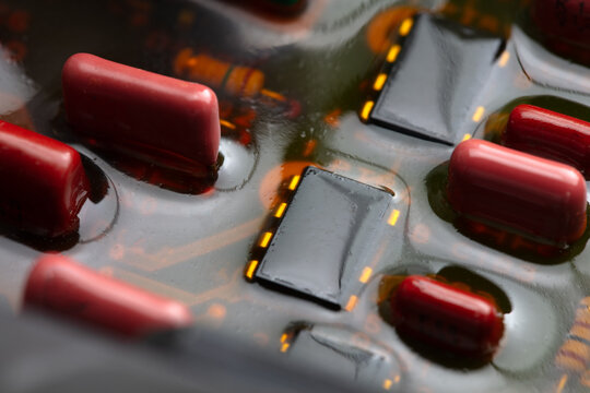 Waterproofed or shock proofed electronic circuit boards and parts. Shallow depth of field.