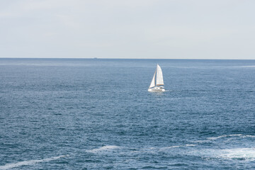 Obraz premium Sailboat on opened sea. Sailing at windy day.