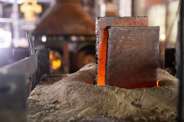 Ferrous metal billet is melted in an induction furnace closeup