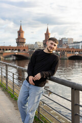 Fototapeta premium handsome man on the bridge 